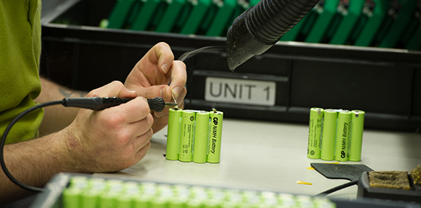 A Steatite technician assembling cells into a custom battery packs